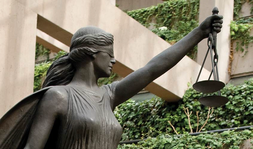 Scales of Justice, Vancouver Law Courts. The blindfolded Lady Justice symbolizes the impartial manner in which our laws are administered: blind to all considerations but the facts.